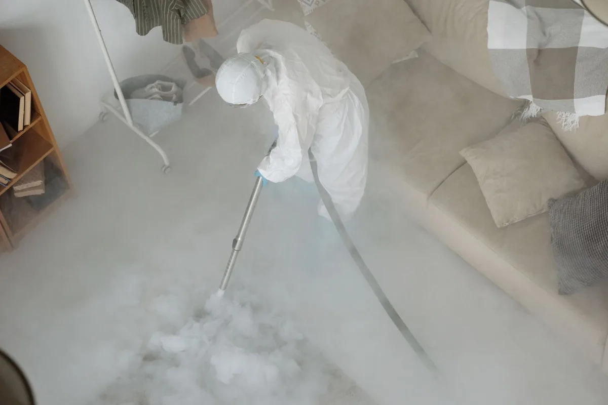 Biohazard cleanup technician in protective equipment, Wynnewood, PA